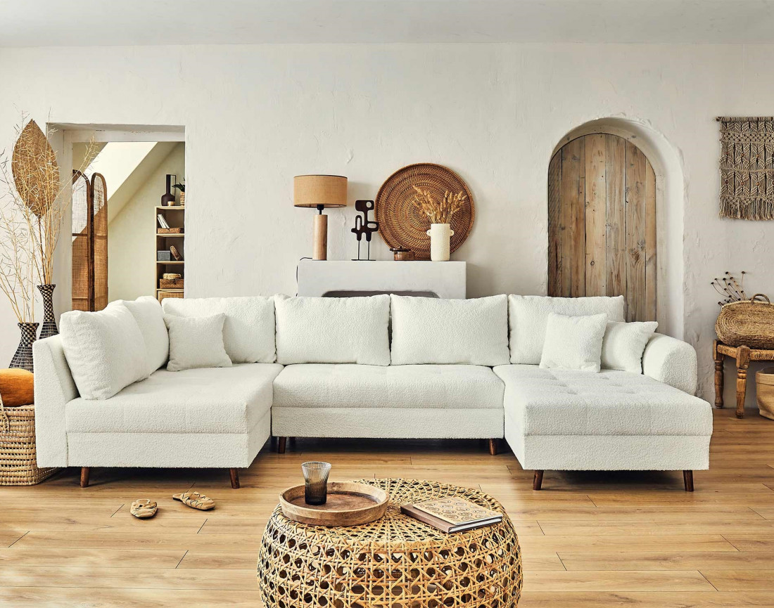 Canapé panoramique d'angle gauche 7 places avec pouf d'appoint en tissu bouclette Rune