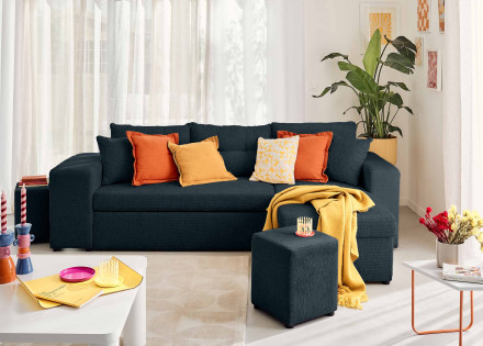 Canapé d'angle réversible 4 places convertible avec coffre, étagère et poufs en velours texturé California