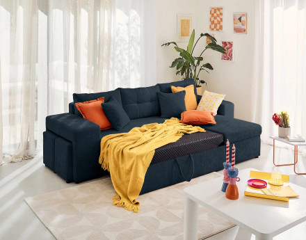 Canapé d'angle réversible 4 places convertible avec coffre, étagère et poufs en velours texturé California