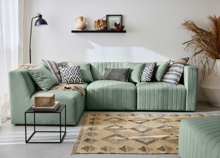 Canapé modulable d'angle gauche 5 places avec pouf d'appoint en velours Nova