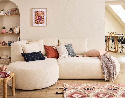 Canapé modulable d'angle gauche 4 places avec pouf en tissu texturé Santorini