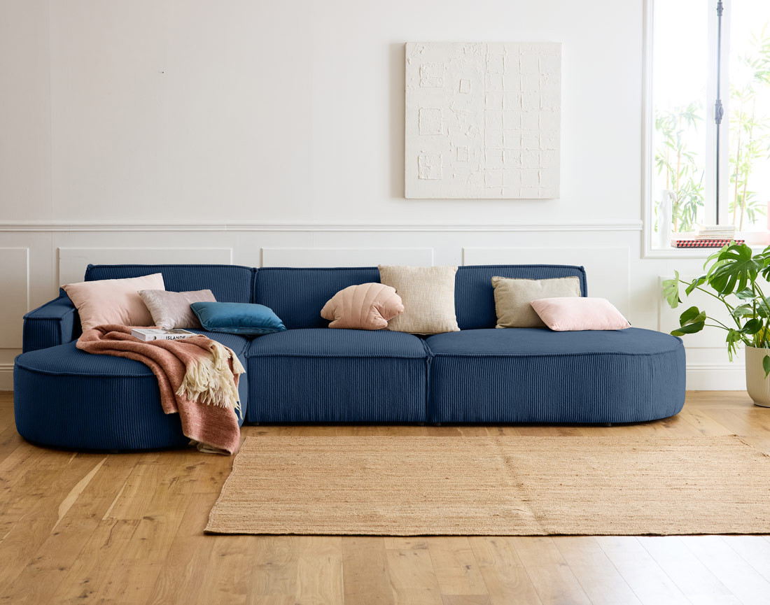 Canapé d'angle gauche aux formes arrondies 5 places en velours côtelé Spiaggia