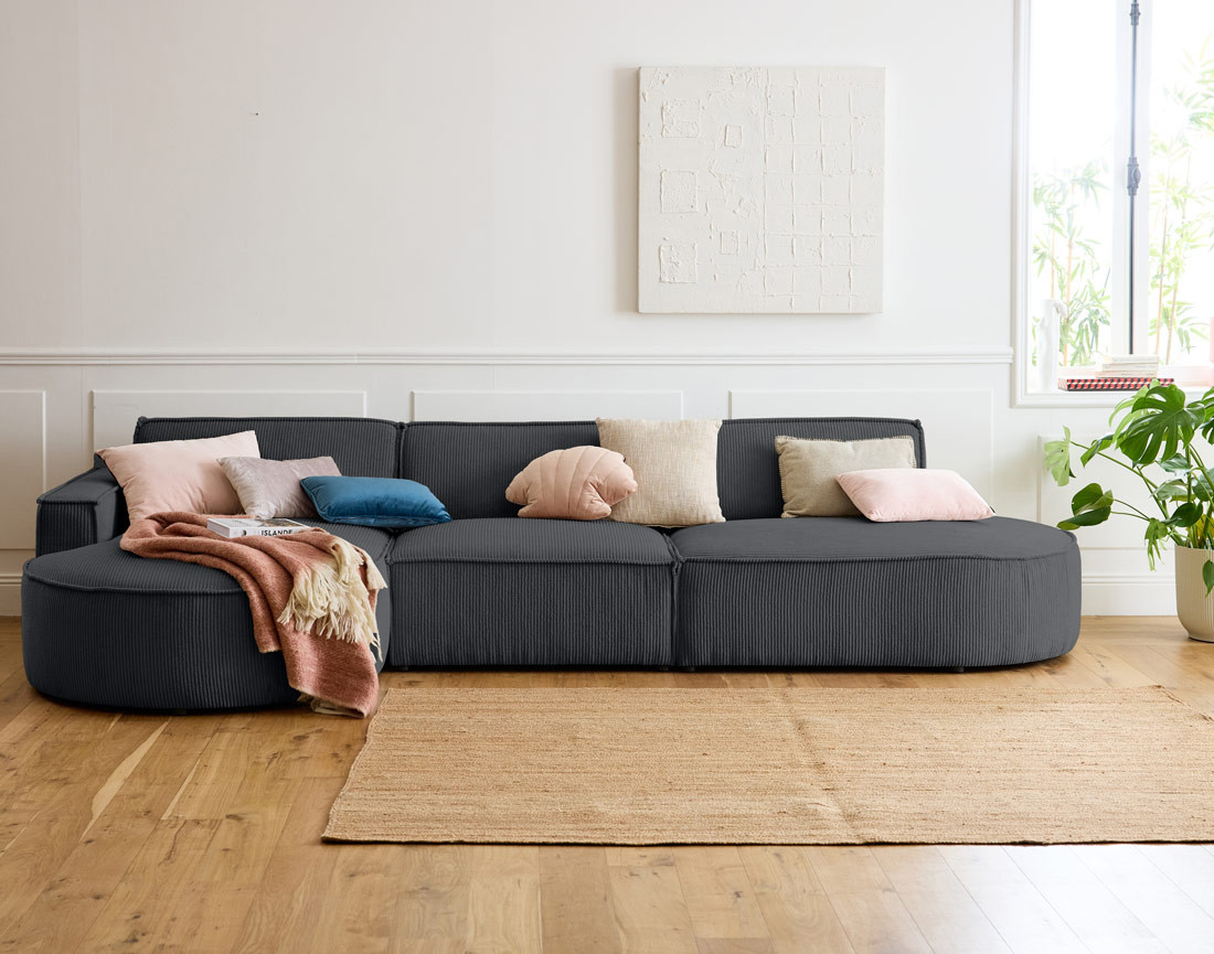 Canapé d'angle gauche aux formes arrondies 5 places en velours côtelé Spiaggia