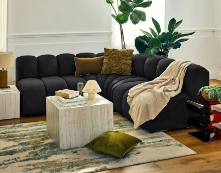 Canapé modulable d'angle réversible 4 places sans accoudoirs en tissu texturé Debbie