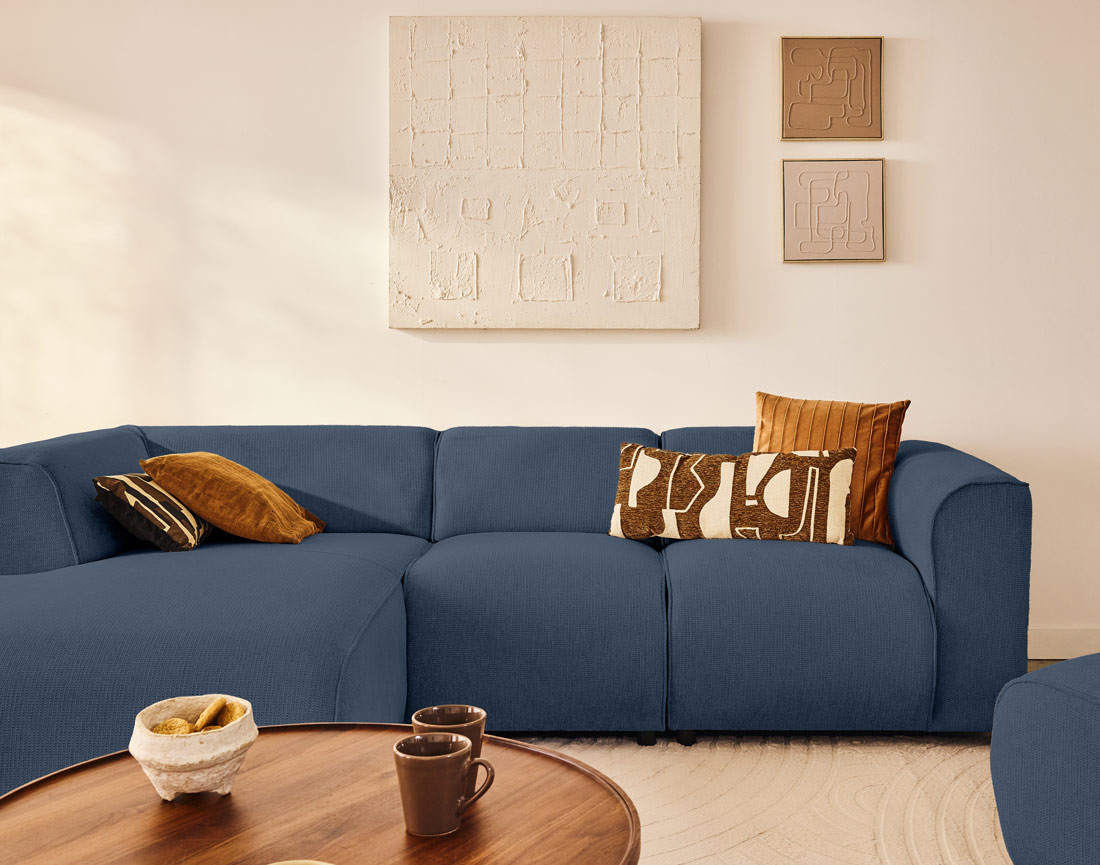 Canapé modulable d'angle gauche 4 places en tissu texturé Suaro