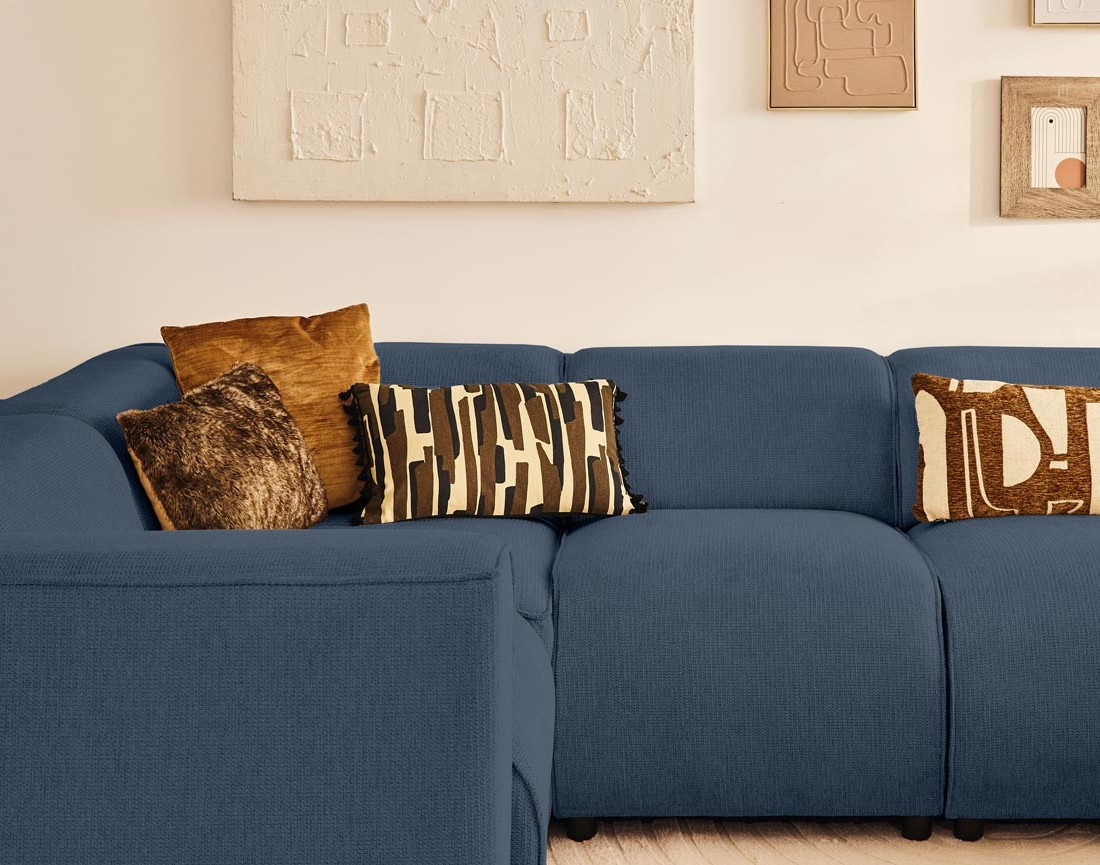 Canapé modulable panoramique d'angle gauche 7 places en tissu texturé Suaro