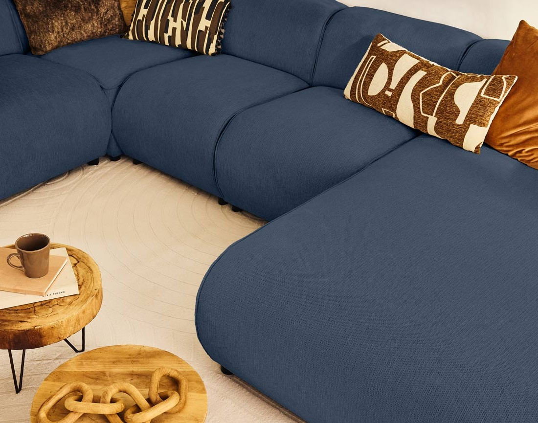 Canapé modulable panoramique d'angle gauche 7 places en tissu texturé Suaro
